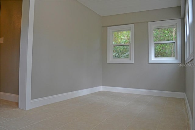 spare room featuring light tile patterned floors