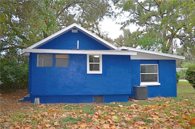 view of home's exterior with cooling unit