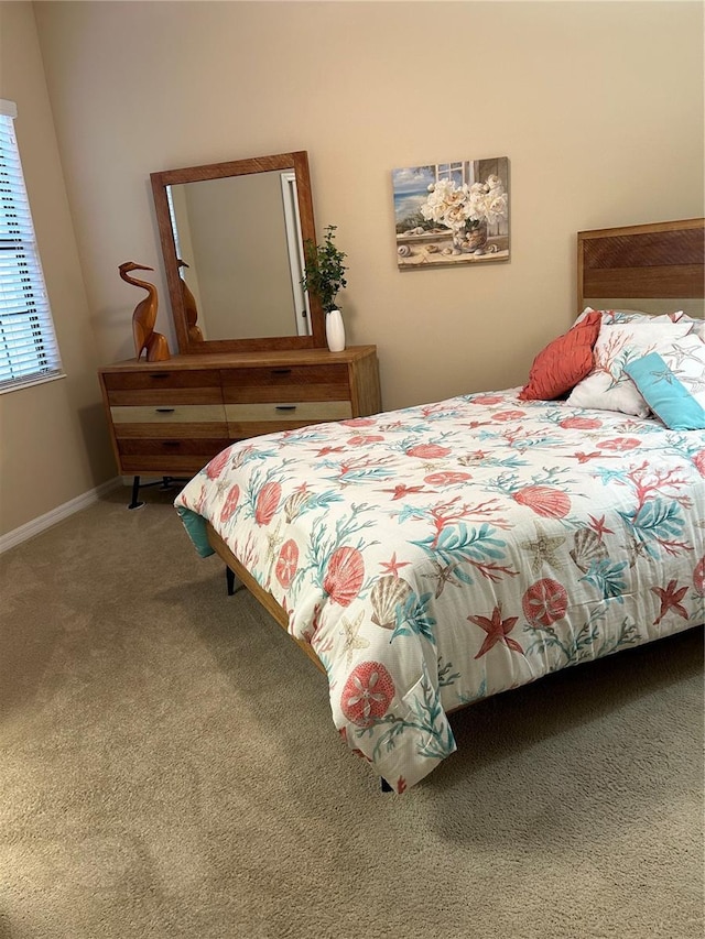 bedroom with carpet flooring and baseboards