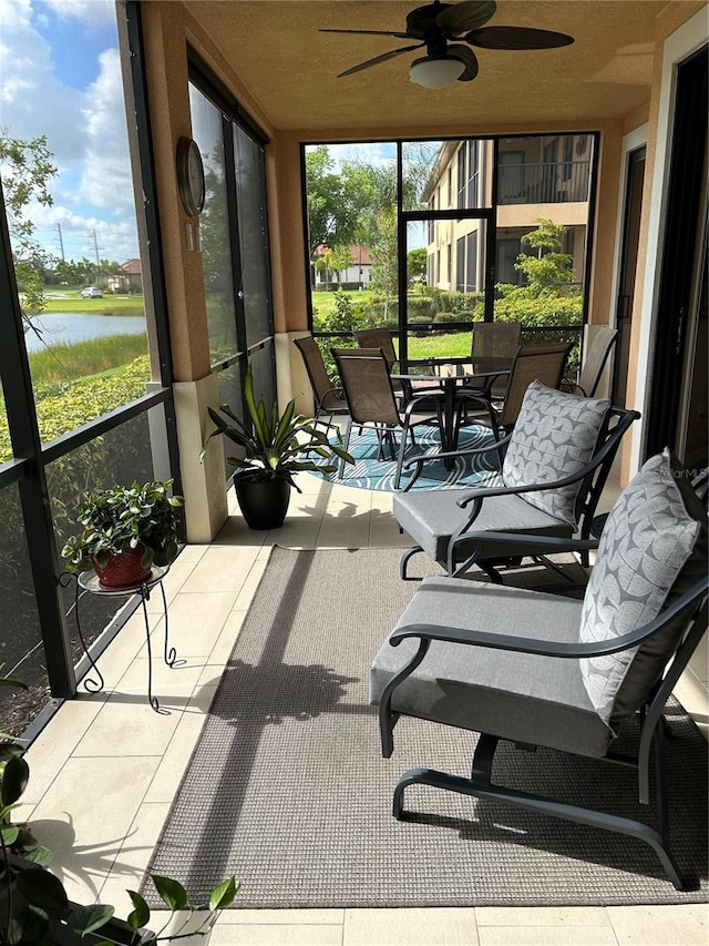 sunroom with a ceiling fan