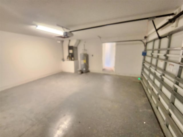 garage with water heater and a garage door opener
