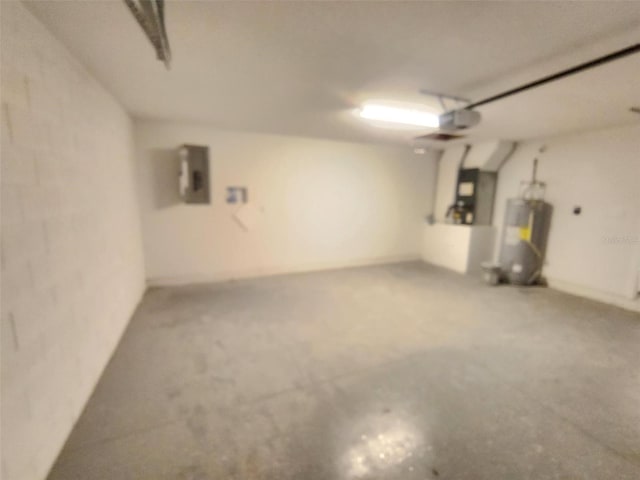 garage featuring water heater, a garage door opener, and electric panel