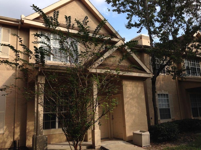 view of side of property featuring stucco siding