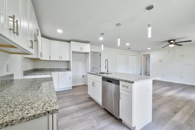 kitchen with white cabinets, dishwasher, ceiling fan, and hanging light fixtures