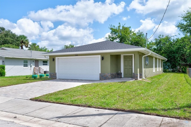 single story home with a front lawn and a garage