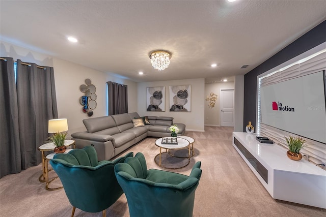 carpeted living room with an inviting chandelier