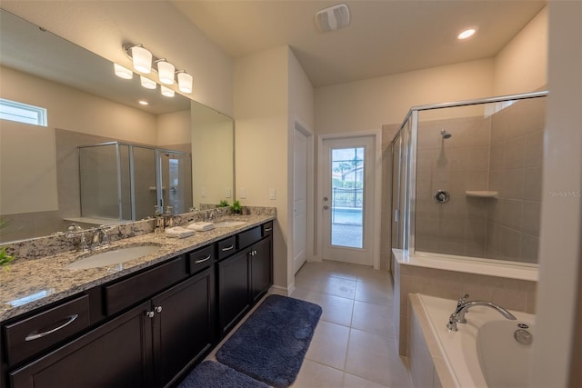 bathroom with shower with separate bathtub, tile patterned flooring, and double sink vanity