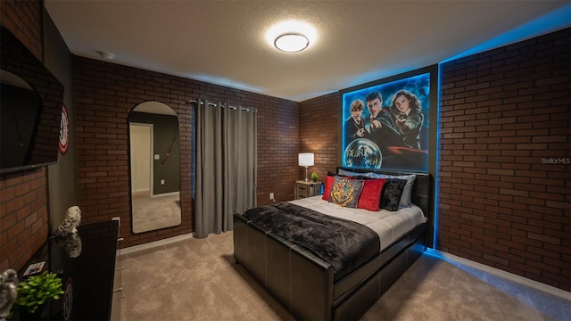 carpeted bedroom featuring brick wall and a textured ceiling