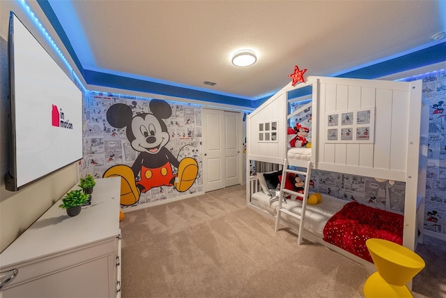 bedroom with light colored carpet