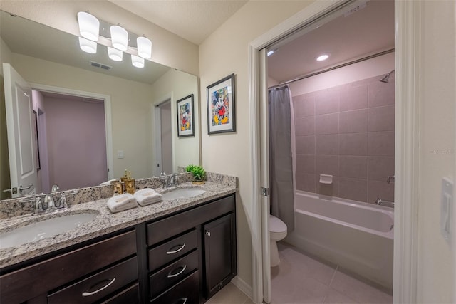 full bathroom with dual vanity, toilet, tile patterned floors, and shower / bath combination with curtain