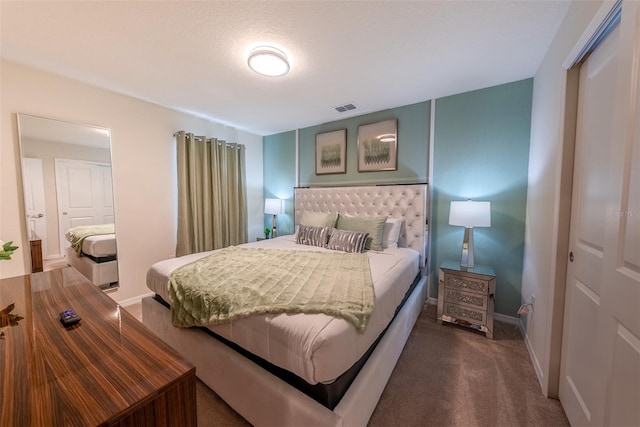 carpeted bedroom featuring a closet