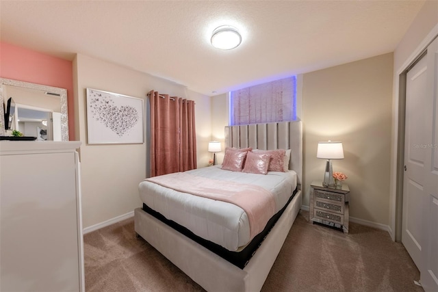 bedroom featuring a closet and carpet flooring