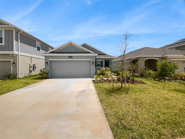 view of front of property featuring a garage and a front yard