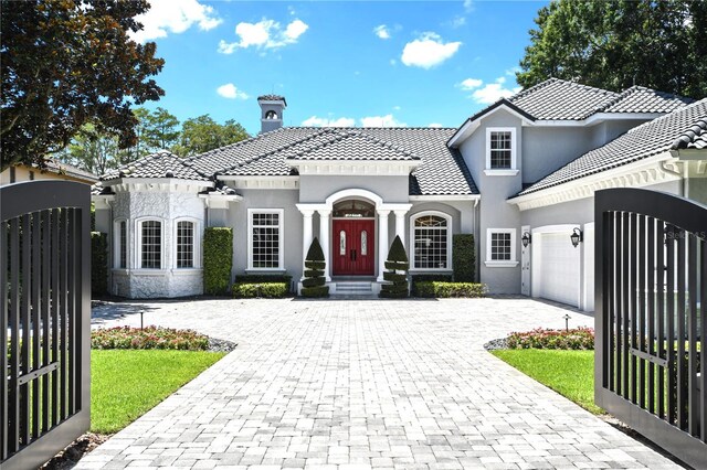 mediterranean / spanish house featuring a garage