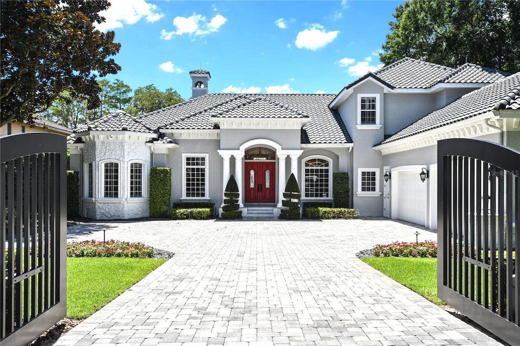 mediterranean / spanish-style house featuring a garage