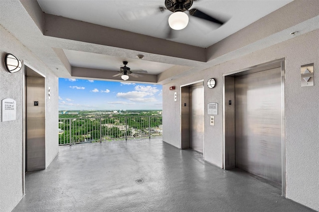 view of patio featuring ceiling fan and elevator