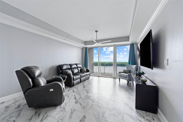 living room with ceiling fan and ornamental molding