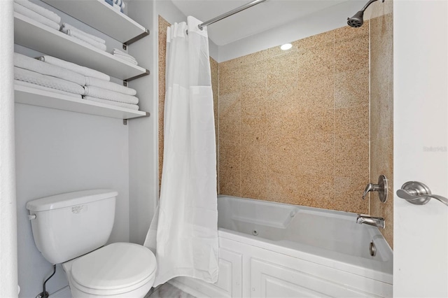 bathroom featuring toilet and shower / tub combo