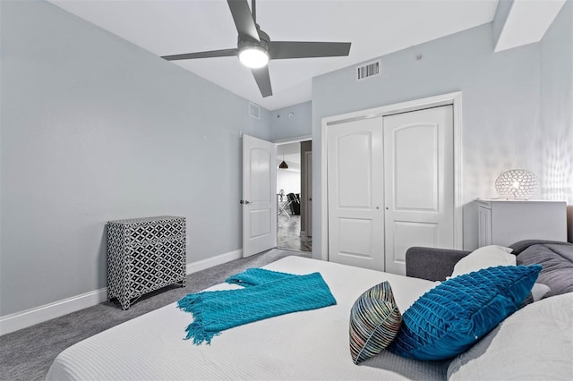 carpeted bedroom featuring ceiling fan and a closet