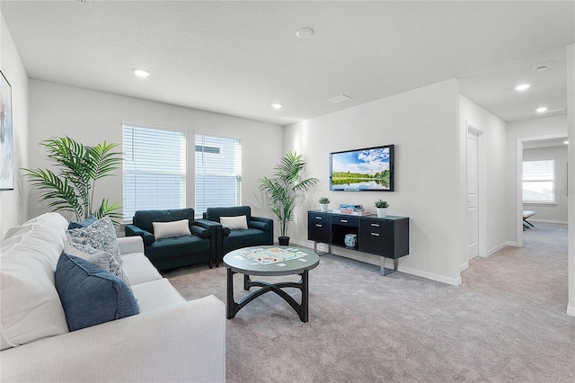 living room featuring light carpet