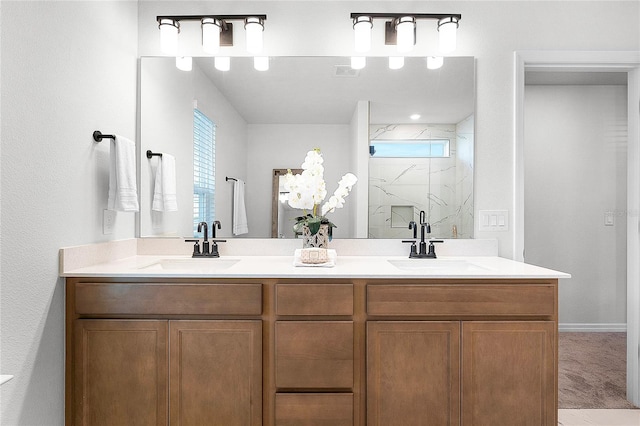 bathroom with vanity and a shower with shower door