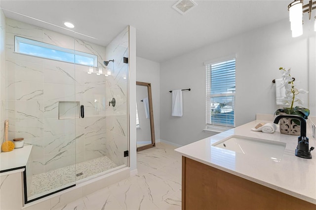 bathroom featuring vanity and an enclosed shower