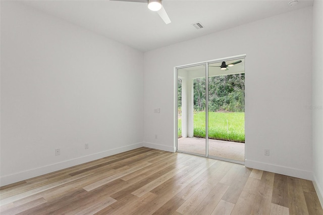 spare room with light hardwood / wood-style floors and ceiling fan