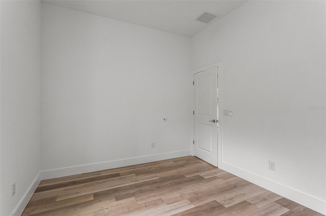 spare room featuring light wood-type flooring