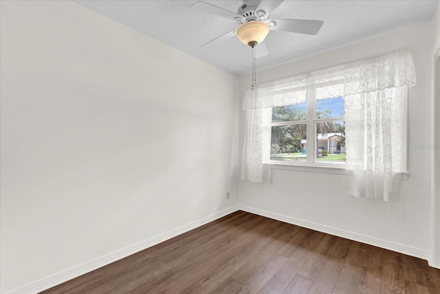 spare room with wood-type flooring and ceiling fan