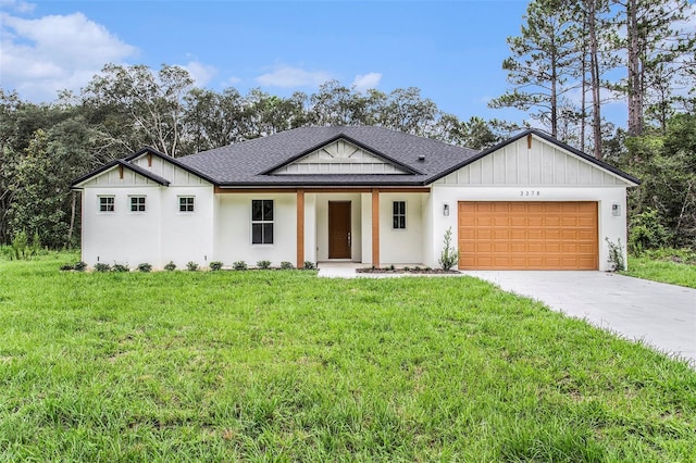 modern farmhouse featuring a garage and a front yard