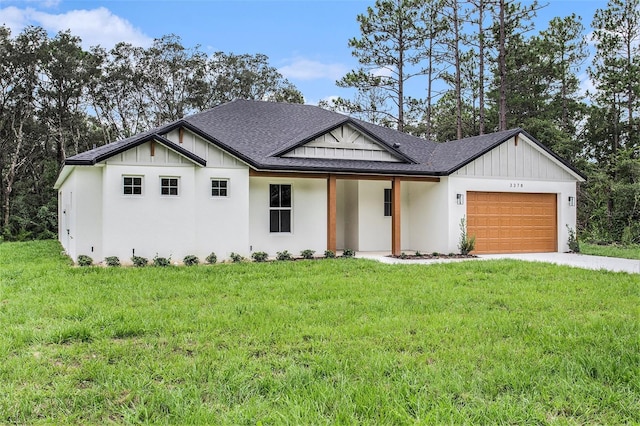 modern farmhouse style home with a garage and a front lawn