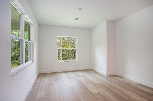 unfurnished room featuring light wood-type flooring