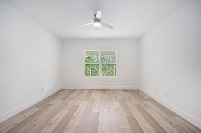 spare room featuring ceiling fan and light hardwood / wood-style flooring