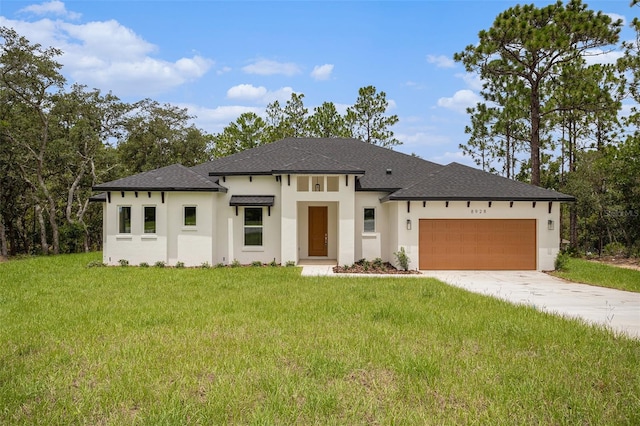 prairie-style house with a garage and a front yard