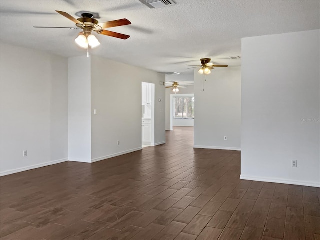 unfurnished room with a textured ceiling