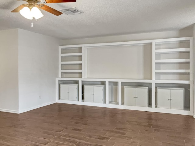 interior space with hardwood / wood-style flooring, ceiling fan, and a textured ceiling