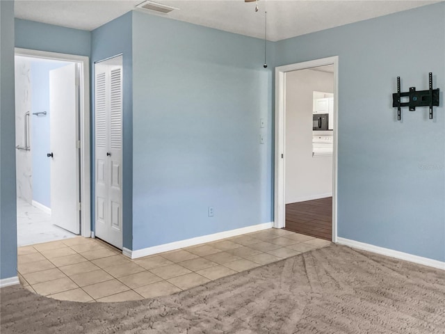 spare room with light colored carpet