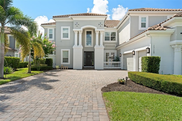 mediterranean / spanish-style house featuring a garage