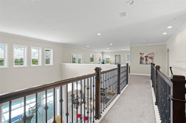 hallway featuring carpet flooring and ornamental molding