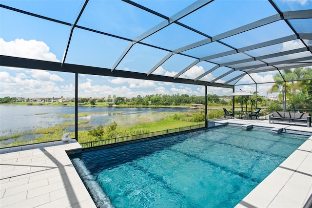 view of swimming pool featuring a patio area, a lanai, and a water view