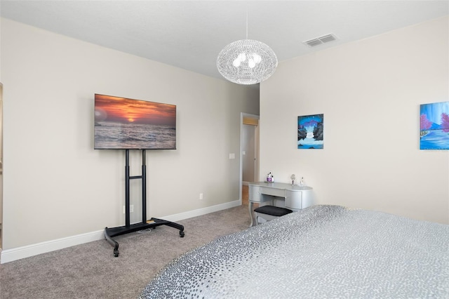 carpeted bedroom featuring a notable chandelier