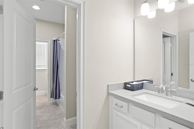 bathroom with vanity and shower / bathtub combination with curtain