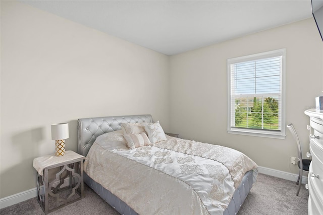 bedroom featuring light colored carpet