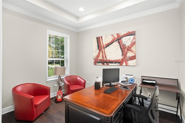 home office featuring dark hardwood / wood-style floors, ornamental molding, and a tray ceiling