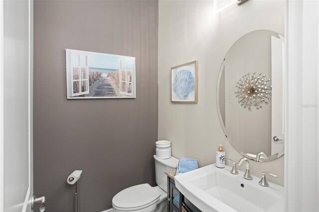 bathroom featuring toilet and sink