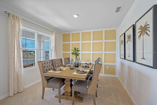 view of carpeted dining area