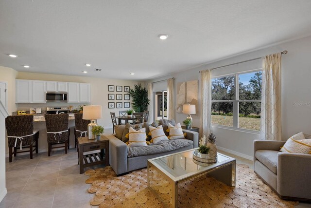 living room featuring light tile patterned flooring