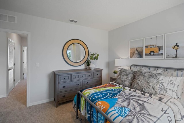 bedroom with light carpet