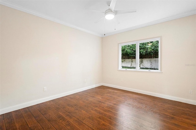 spare room with ceiling fan, crown molding, and dark hardwood / wood-style floors