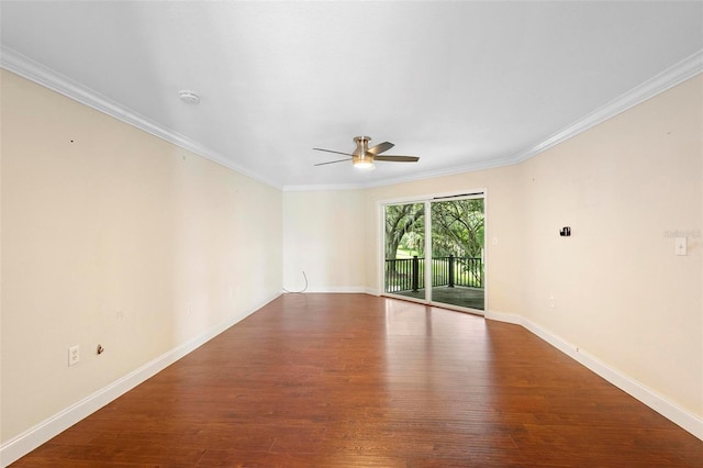 spare room featuring ceiling fan, wood-type flooring, and crown molding